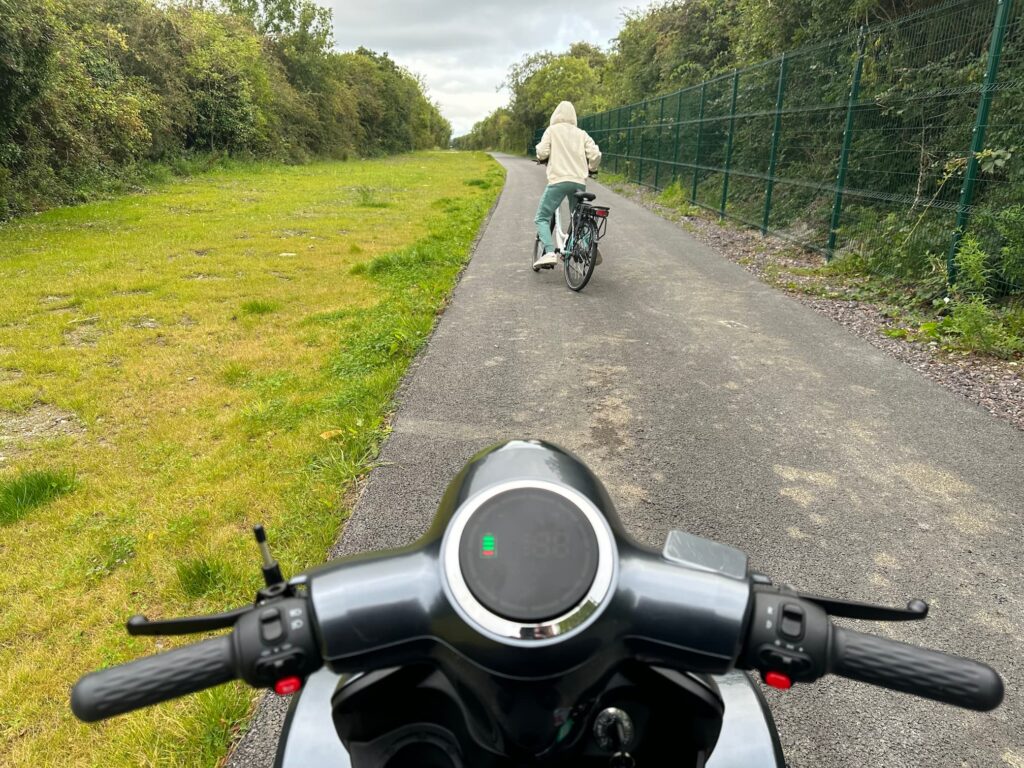 A POV shot of riding an electric bicycle on the Boyne Valley to Lakelands County Greenway in Navan