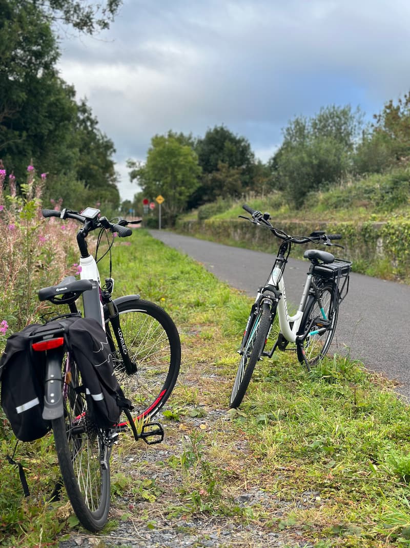 Two electric bicycles parked to the side of the Boyne Valley to Lakelands County Greenway in Navan